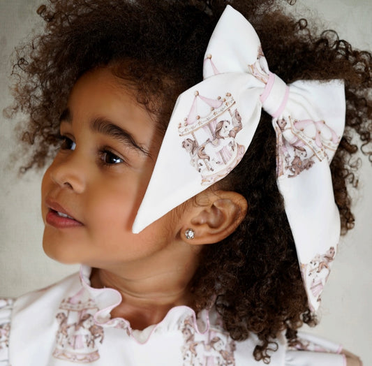 Babine girls A/W carousel hair bow available in pink or blue
